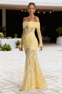 Detail of elegant pale yellow off-shoulder lace evening dress with ruched bodice