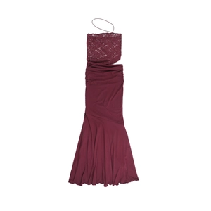 Detail of burgundy lace bodice with halter ties and ruffled mermaid hem on party dress