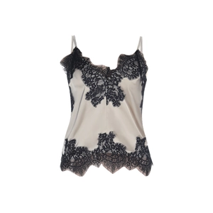 Close-up of champagne silk camisole with black lace trim and delicate spaghetti straps