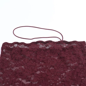 Close-up of intricate burgundy floral lace crochet detail with delicate elastic straps