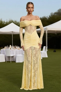 Detailed view of the yellow lace evening gown featuring intricate pleated texture