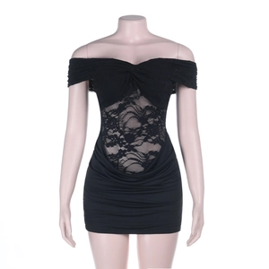 Close-up of black strapless mini dress featuring floral lace waist cutout and pleated skirt