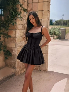 Chic black corset mini dress with lace trim and pleated bodice for summer party