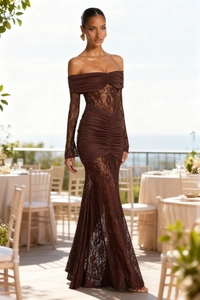 Detail of a slim fit deep brown evening gown with lace sleeves and ruched texture