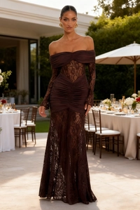 Detail of ruched coffee lace evening gown with off-shoulder design and sheer floral skirt