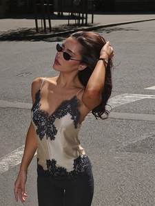 Champagne satin camisole with black eyelash lace trim for a stylish summer street look