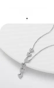 Detailed view of sterling silver heart pendant necklace with shimmering zircon stones