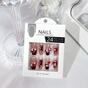 Press-on nail set featuring 3D white camellia flowers and pearls on long ballet tips