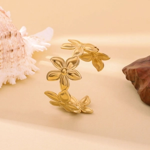 Golden flower petal open cuff bracelet in stainless steel with a matte textured finish