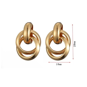 Elegant gold triple interlinked hoop earrings with high-polish metallic finish, 29mm height