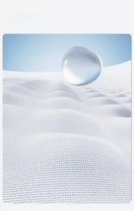 Macro detail of white waffle weave cotton towel with water droplet showing high absorption