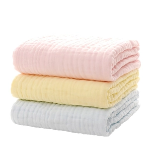 Three-pack ultra-soft cotton gauze baby towels in pink, yellow, and light blue colors
