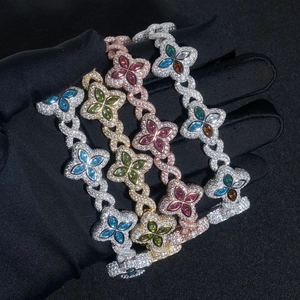 Detailed macro view of four multicolored clover bracelets with sparkling marquise gemstones