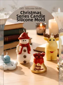 DIY Christmas silicone molds for snowman, reindeer, and bell candles on a cozy desk