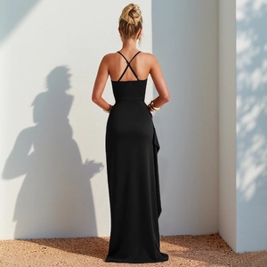 Detail view of black off-shoulder maxi dress with crisscross back and ruffle hem