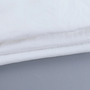 Close-up of the white plain weave fabric texture on a slim fit cutout T-shirt for women
