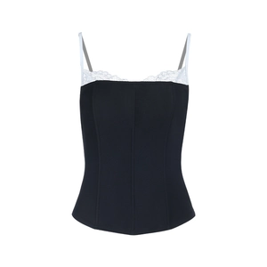 Close-up of contrast lace trim and structured corset seams on black camisole top