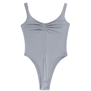 Detail of grey bodysuit with ruched chest design and snap button closure at bottom
