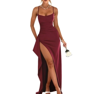 Detail of wine red strapless evening dress featuring elegant side slit and ruched waist texture