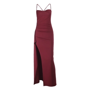 Detail of burgundy slit dress showing delicate spaghetti straps and pleated waist textures