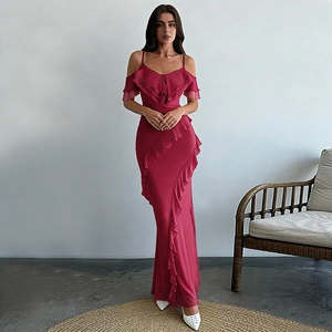 Detail of elegant magenta off-shoulder dress with double-layered ruffles and slim fit design