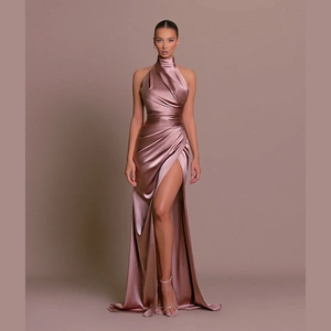 Elegant rose gold satin halter neck evening dress with high slit and draping details