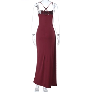 Back view of burgundy strapless maxi dress featuring criss-cross straps and a sleek back slit