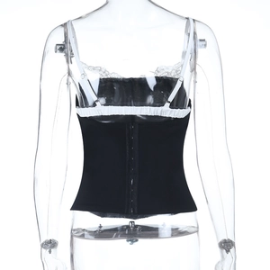 Close-up of black corset top with white lace trim and back hook-and-eye closure