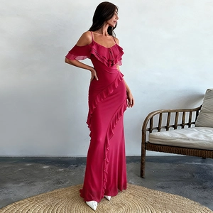 Detail showing the elegant ruffled cold-shoulder design and fishtail hem of this rose red dress
