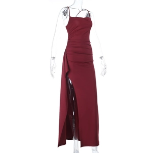 Detail of burgundy evening dress with pleated waist design and high side slit
