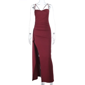 Close-up of wine red sleeveless maxi dress featuring pleated details and high side slit