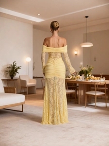 Elegant off-shoulder pale yellow lace maxi dress with long sleeves and pleated body