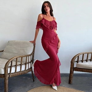 Detailed view of ruffles on a burgundy off-the-shoulder evening dress with fishtail hem