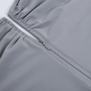 Detailed macro view of the seamless invisible zipper on a slim fit grey bodysuit fabric
