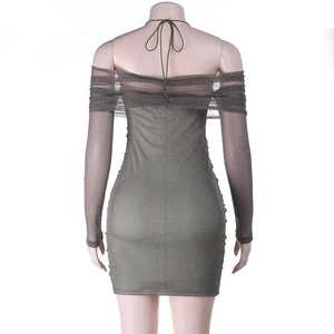 Detail of glittery fabric texture and tie-up back design on the off-shoulder dress