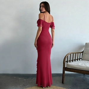 Close-up of wine red off-shoulder dress with elegant layered ruffle sleeves and sleek slim fit