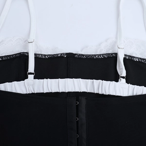 Close-up of lace trim, adjustable straps and hook-eye back closure on contrast crop top