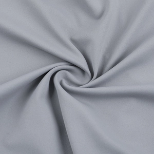 Detailed close-up of grey knitted fabric with premium texture and subtle elastic sheen