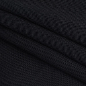 Close-up of the breathable black knitted fabric texture with elegant draped folds
