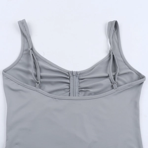 Detail view of grey sleeveless bodysuit showing adjustable straps and front zipper with ruching