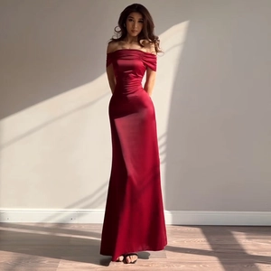 Detailed view of dark red satin fabric with elegant off-the-shoulder pleated neckline