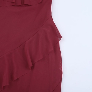 Detail of layered burgundy mesh ruffles on a strapless A-line party dress