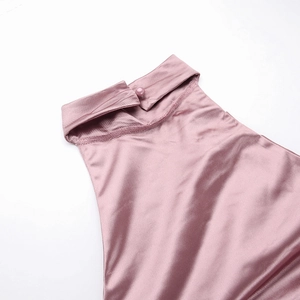 Detail of high collar neck with satin luster and button closure on pink party dress