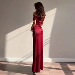 Detailed back view of burgundy satin gown featuring adjustable corset lace-up tie closure