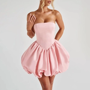 Detail of pink strapless bubble hem mini dress with corset bodice and satin finish