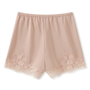 Detailed view of elegant pink silk shorts with delicate eyelash lace trim and elastic waist