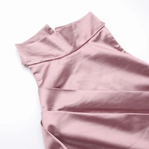 Detailed view of pink satin dress featuring high collar neckline and pleated fabric texture
