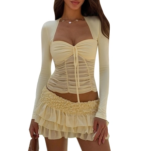 Detail of light yellow slim-fit top with heart pleated neckline and drawstring