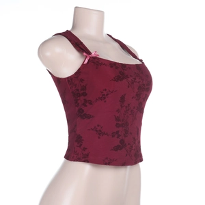Detail of dark red floral tank top featuring delicate pink bow accents on shoulder straps
