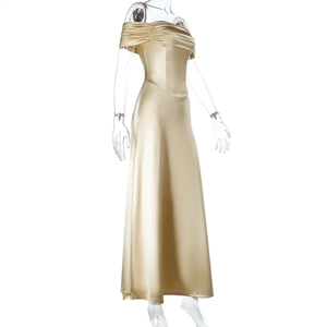 Detailed view of the pleated off-shoulder neckline on a champagne satin gown